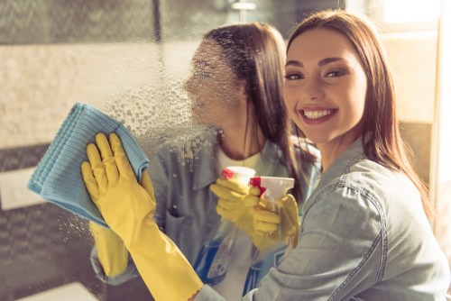 Interior window cleaning in a modern home with natural light